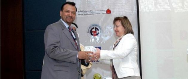 8. Dr. Khan Receiving Award From A Lady